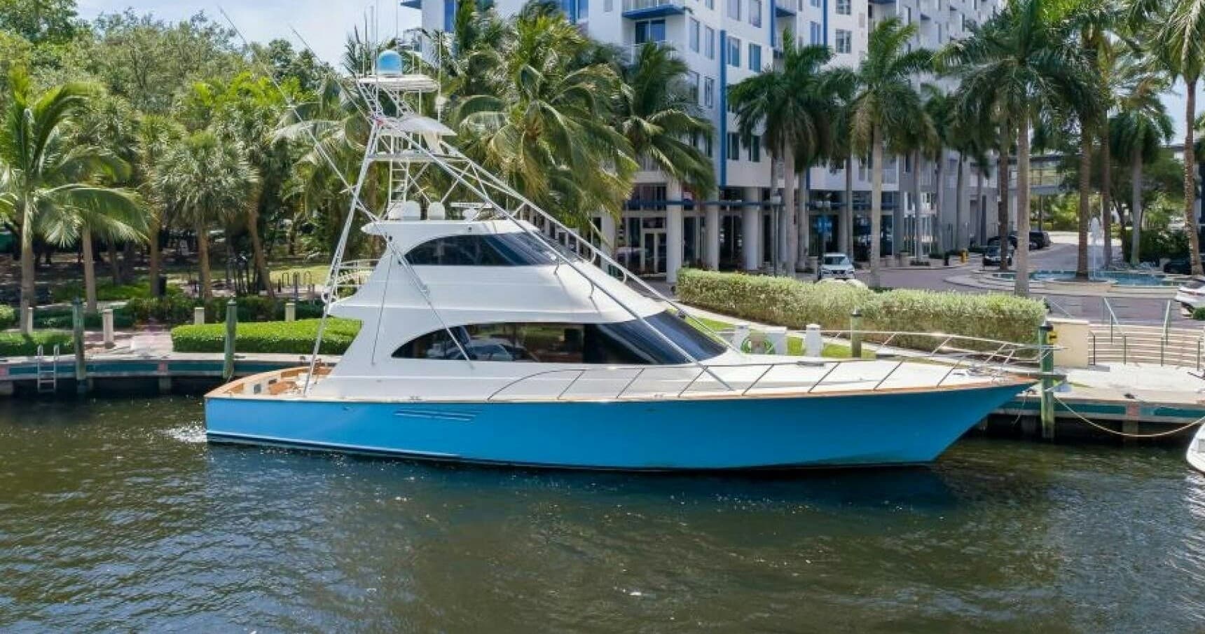 Sportfishing yacht docked by tropical marina, waterfront leisure
