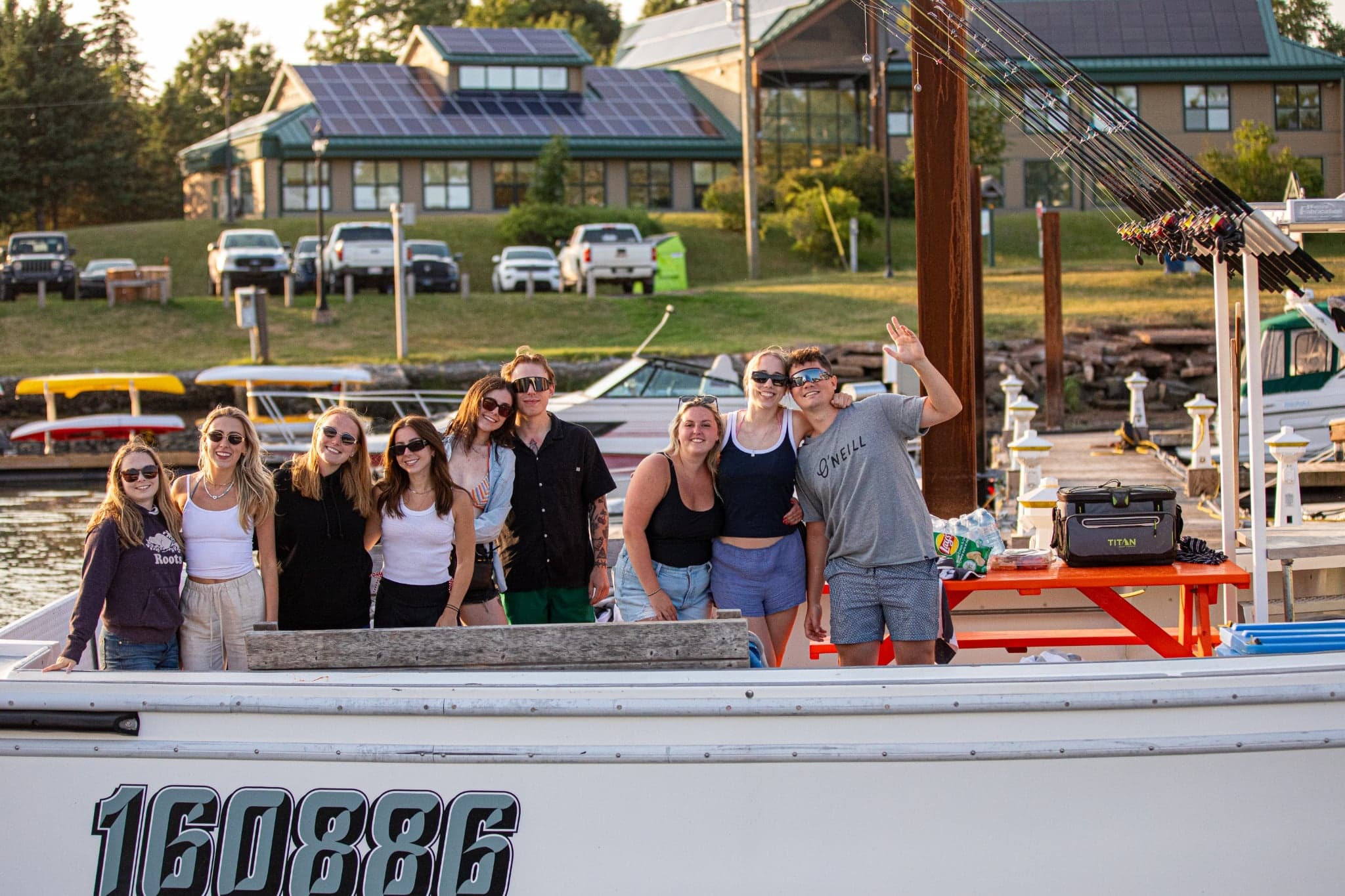 Friends on boat tour at marina enjoying scenic river cruise