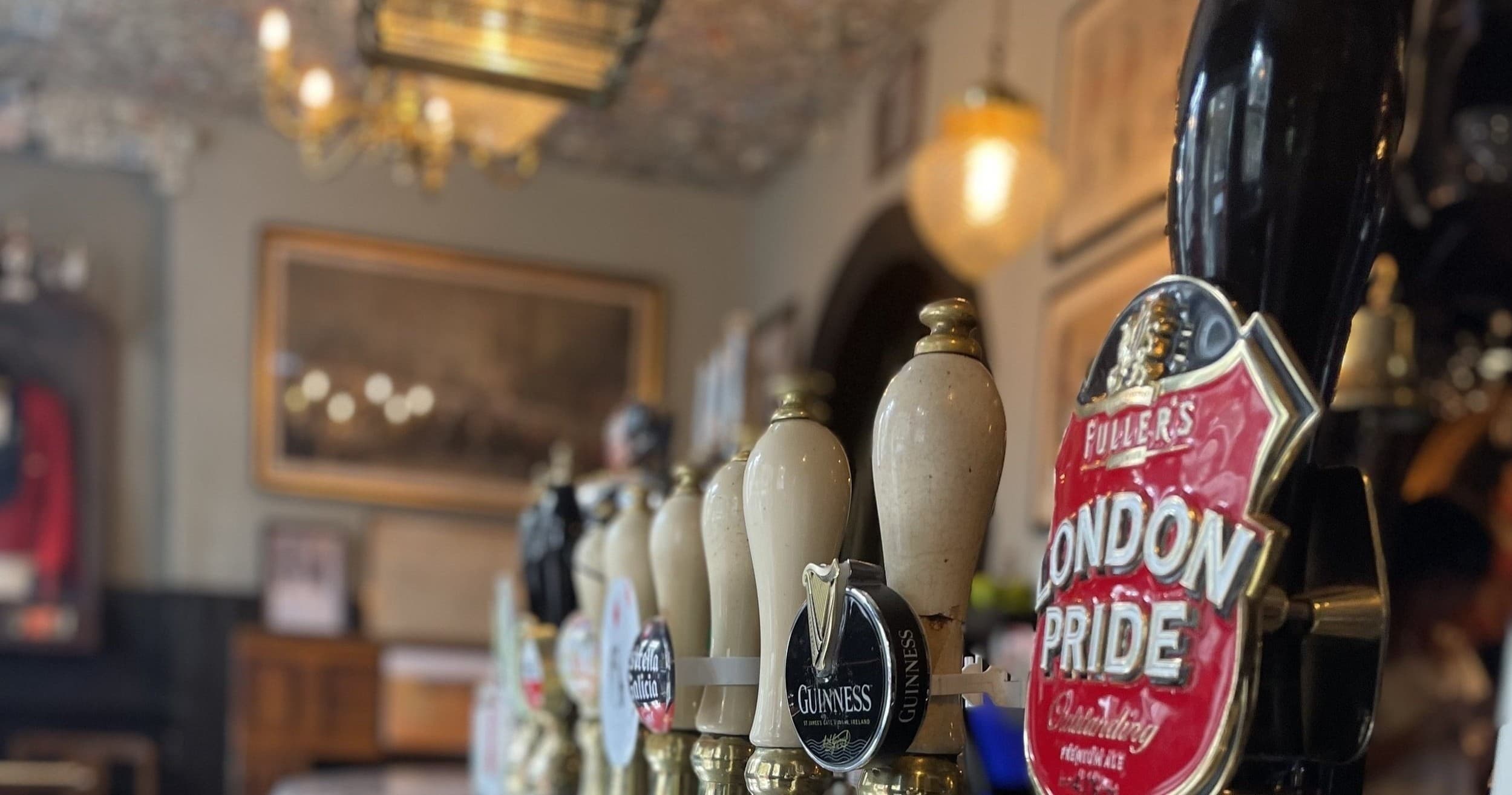 Pub beer taps and bar interior showing indoor pub experience