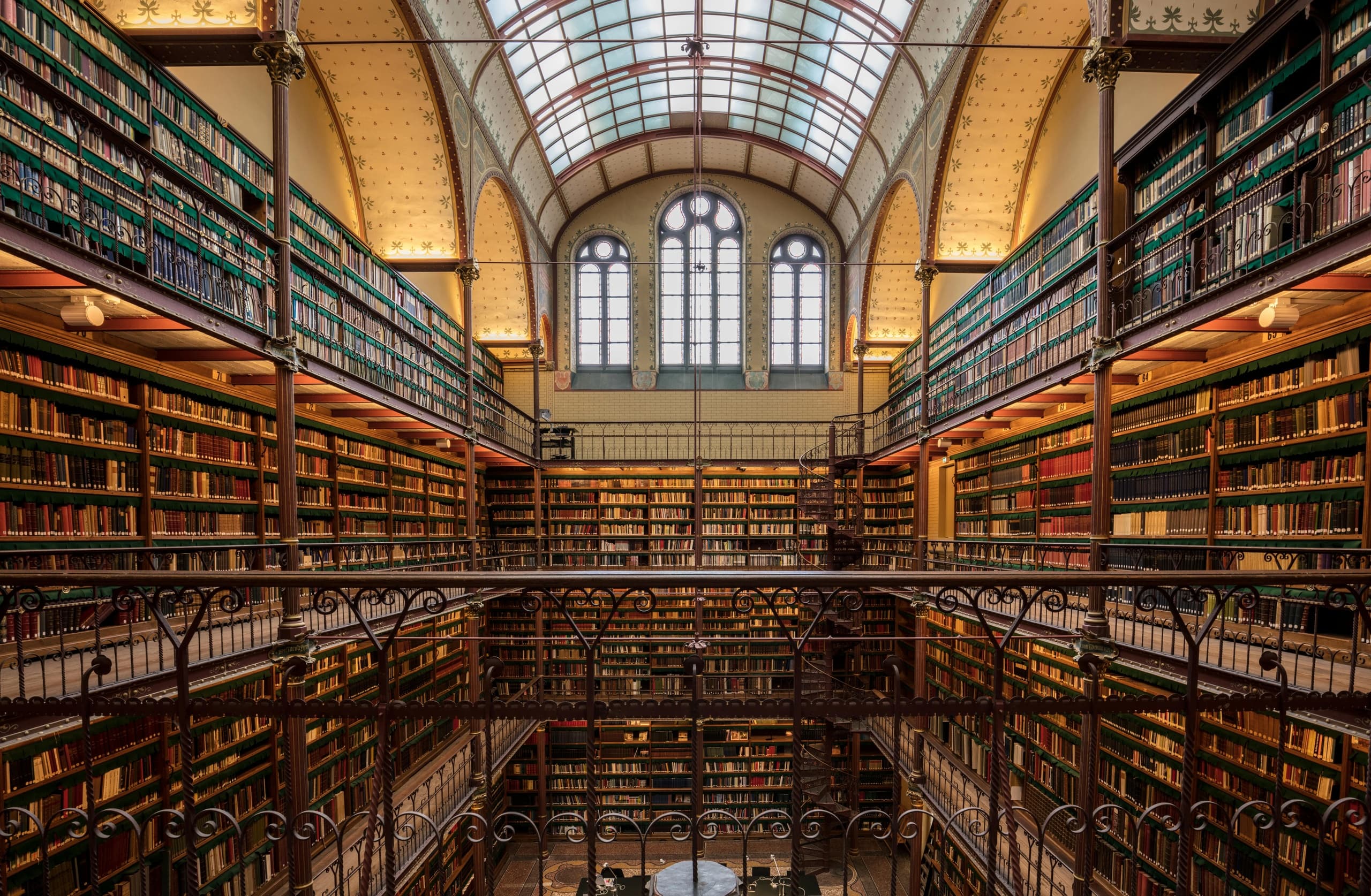 Ornate historic library interior with stacked books and gallery