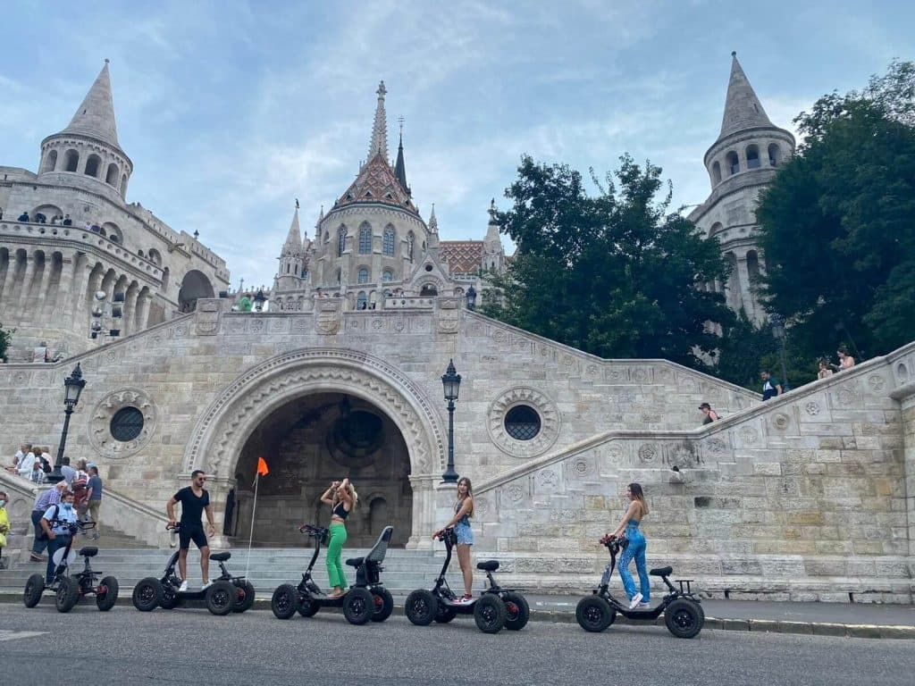 Electric scooter tour with riders in front of Budapest Fisherman's Bastion