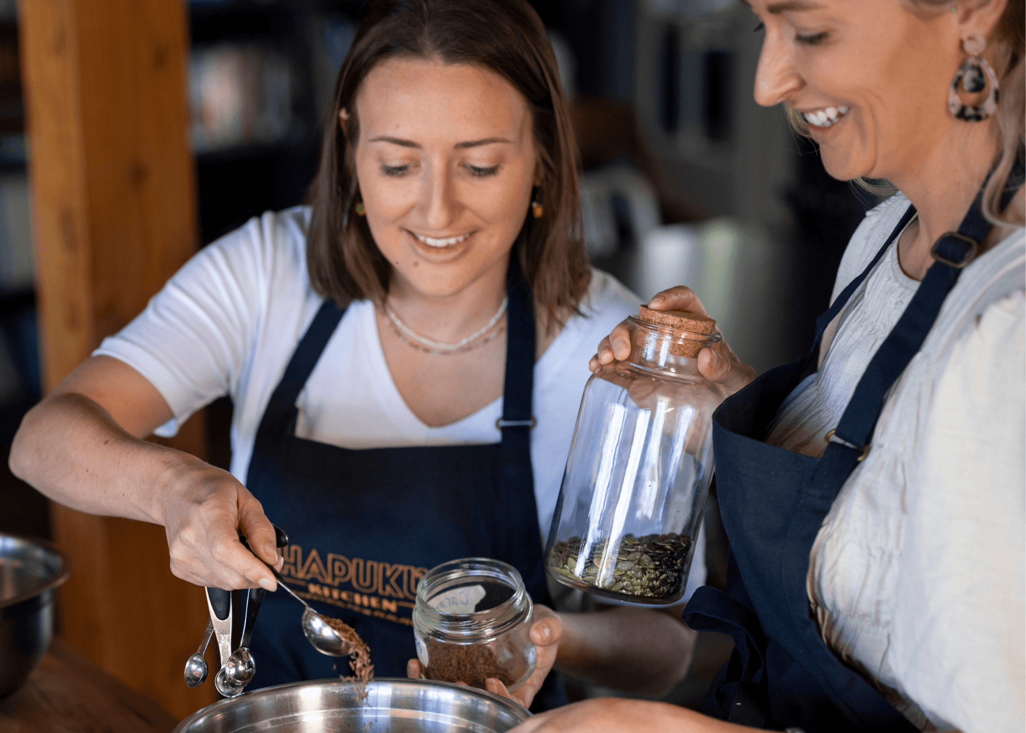 Chefs measuring herbs in kitchen for farm-to-table cooking