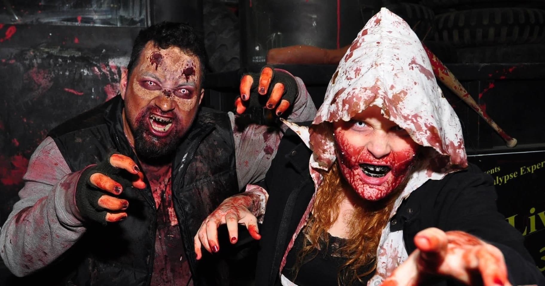 Close-up zombie performers in haunted attraction makeup indoors