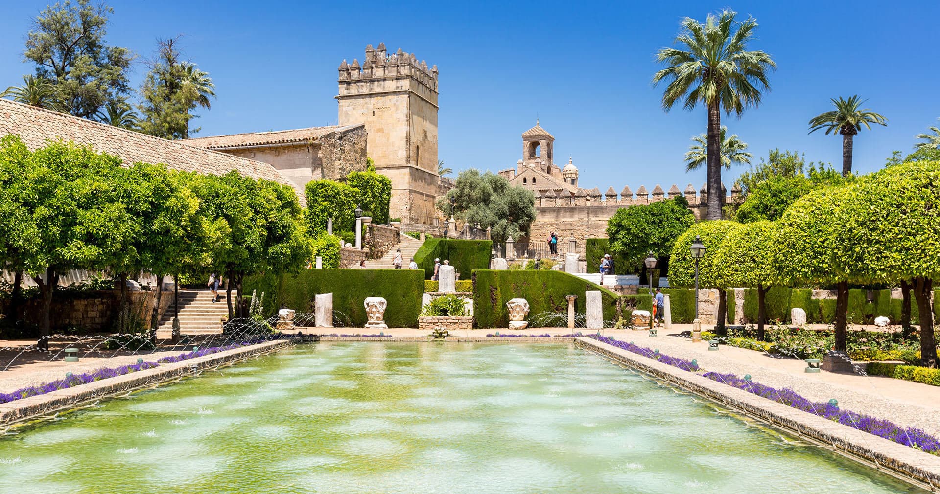 Reflecting pool and fortress gardens at Córdoba Alcázar, sunny