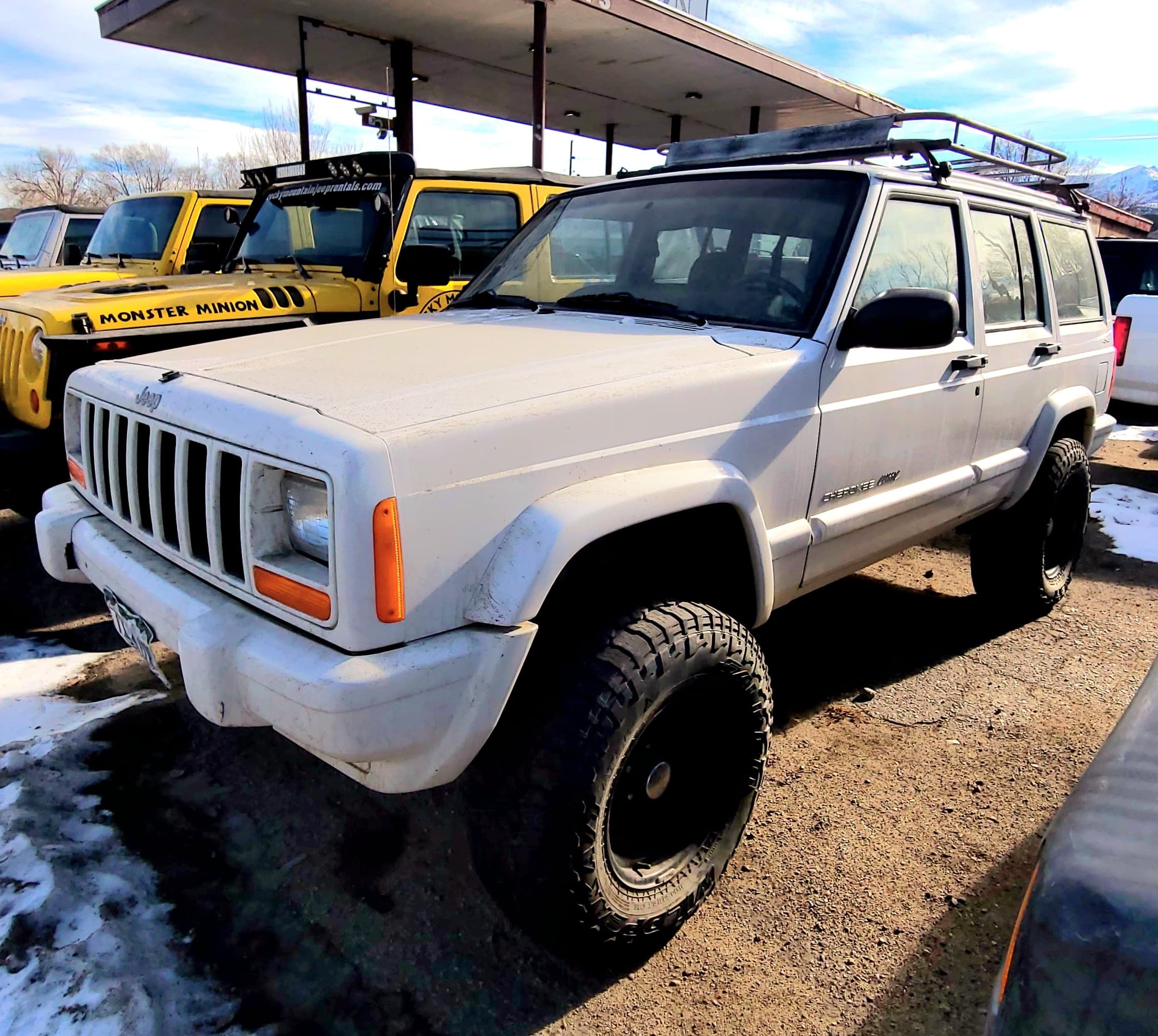 White 4 Door Jeep Cherokee - OG