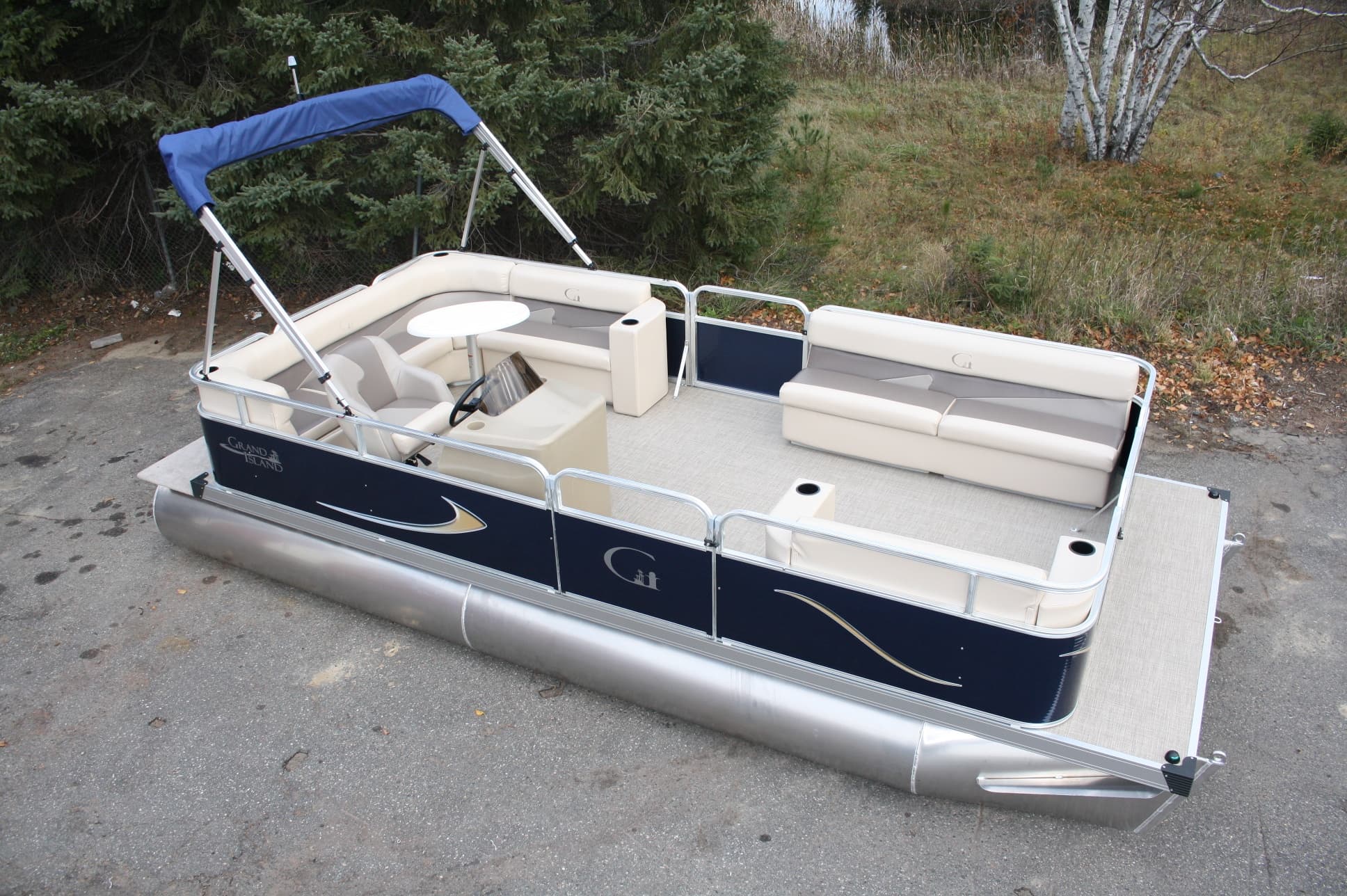 Pontoon boat docked at marina showcasing leisure boating on lake