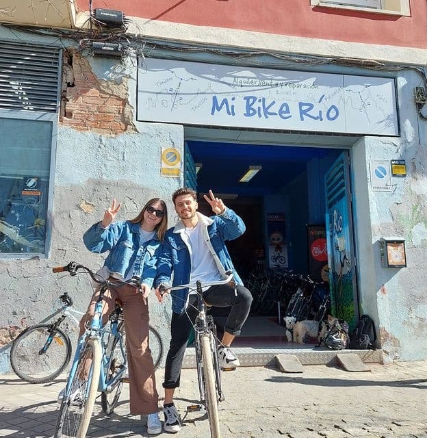Bike rental storefront with smiling guides ready for city tours