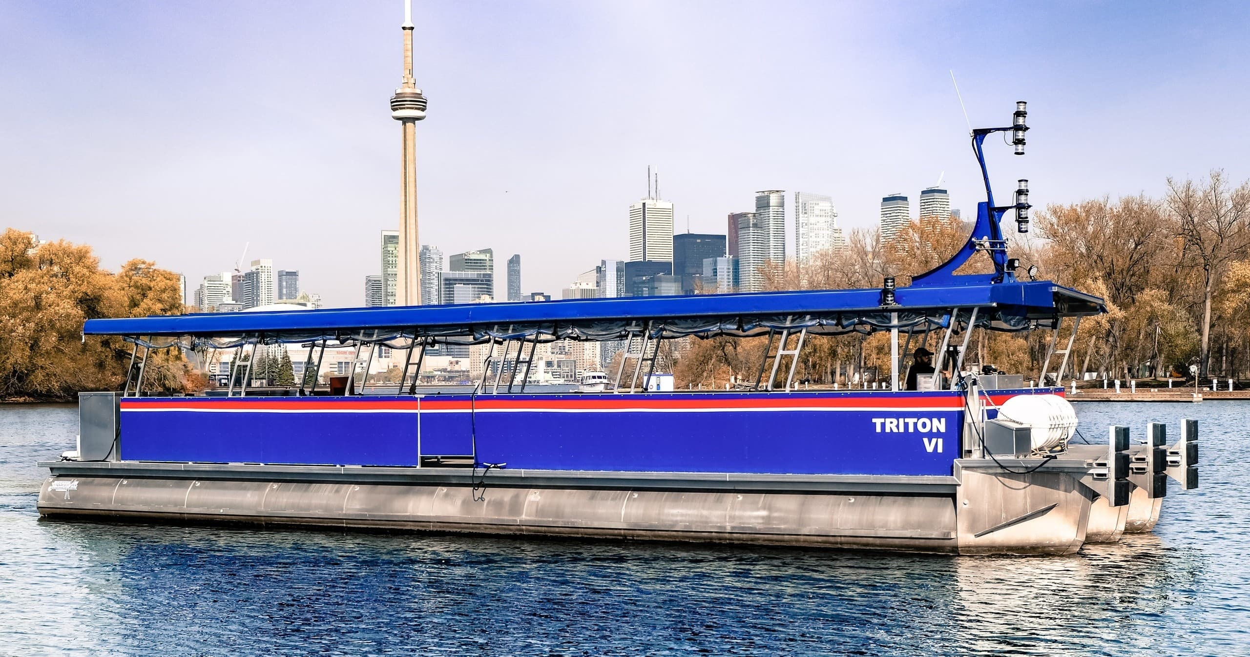 Blue harbour tour boat docked on Toronto island waterfront