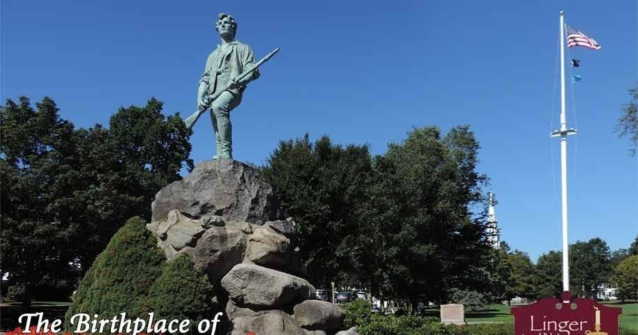 Minuteman statue on Lexington Green with clear blue sky
