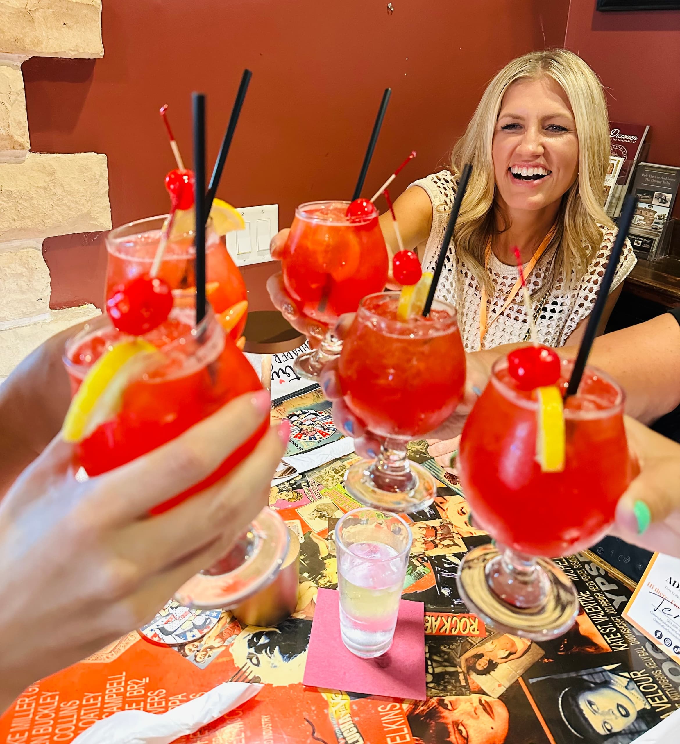 Cheers with cocktails at indoor Galena tasting table
