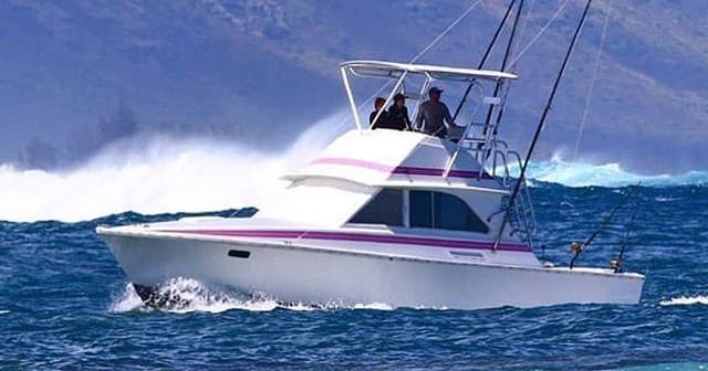 Sportfishing charter boat cruising Pacific waters off Oahu