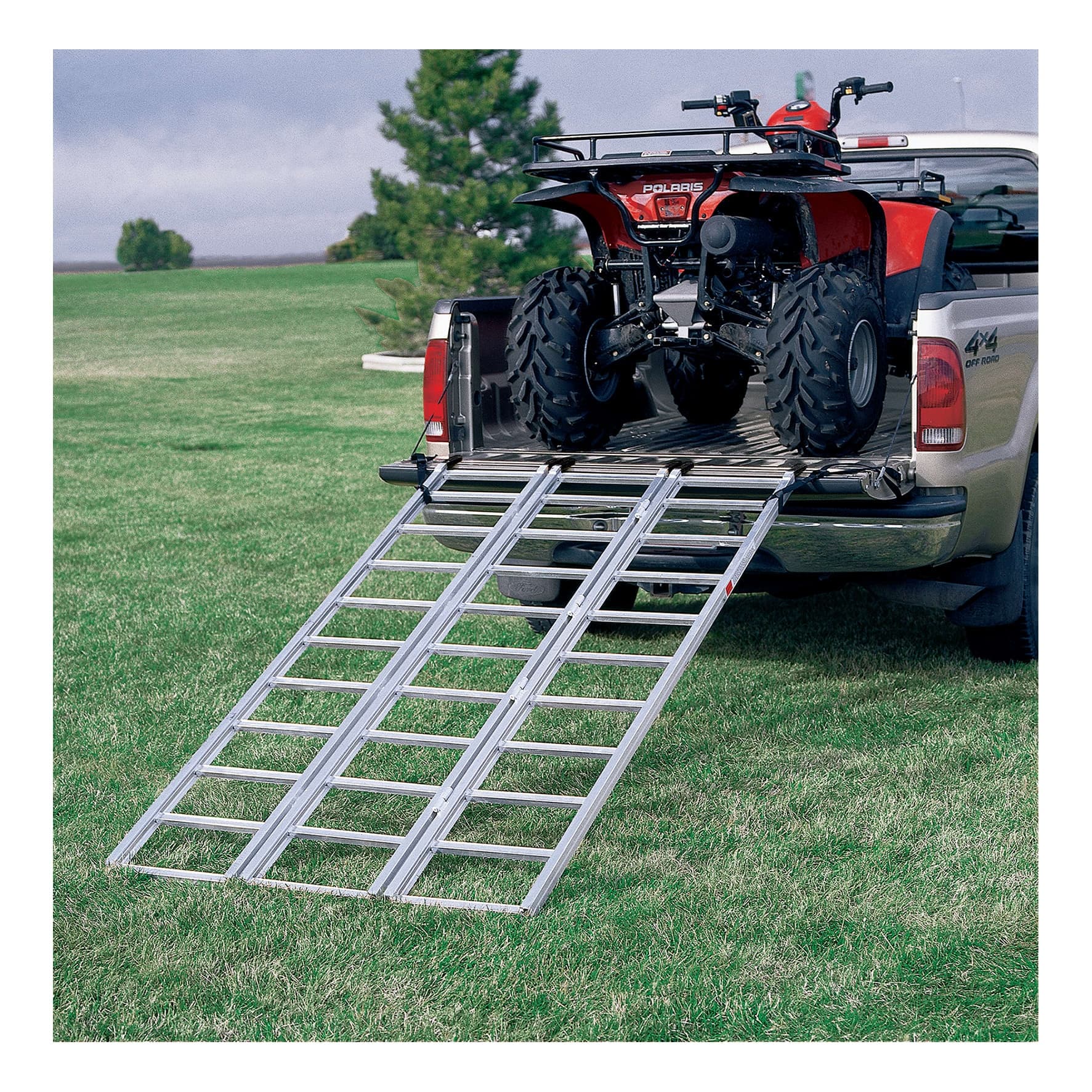 ATV loading into pickup truck bed via aluminum ramp