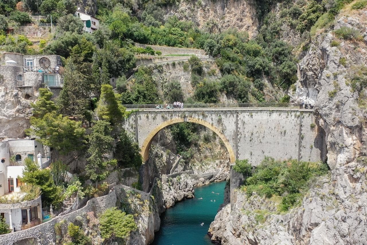 Coastal cliffside bridge and turquoise bay, Amalfi Coast