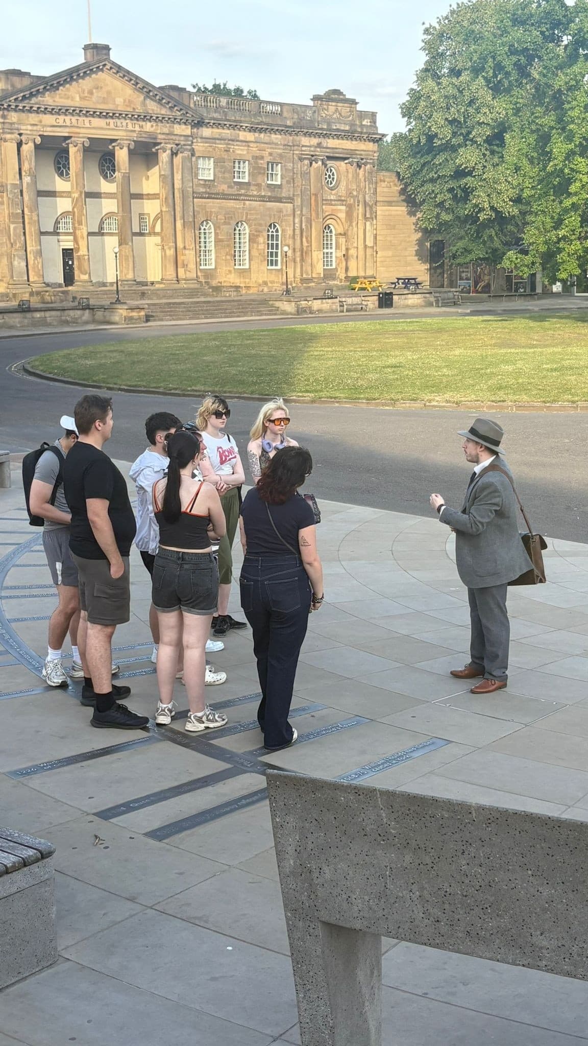 Guided walking tour group outside grand York historic building