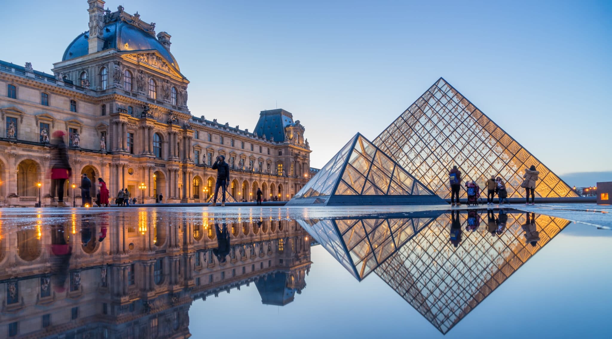 Louvre Pyramid reflecting in Tuileries courtyard, Paris