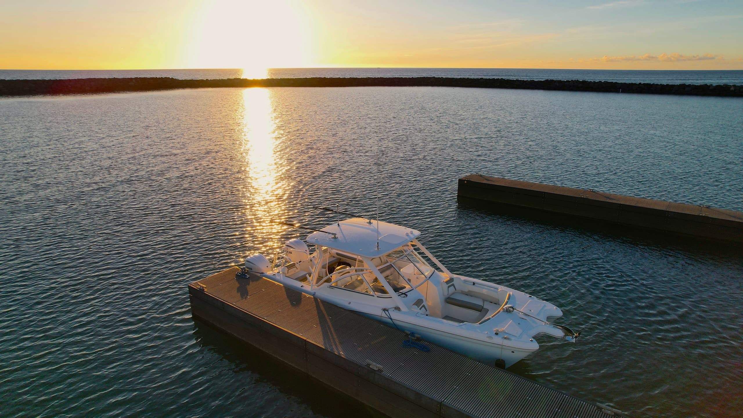 Private yacht moored at sunset harbor, leisure boating experience