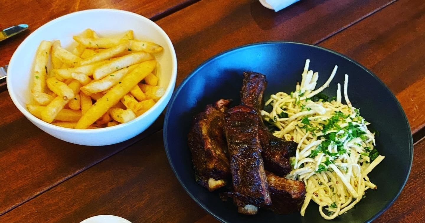 Casual ribs and fries meal served at coastal Santa Barbara eatery