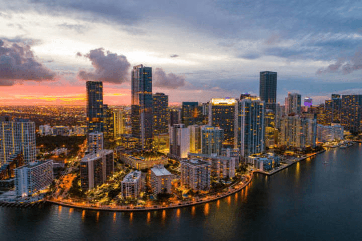 Aerial helicopter tour over Miami skyline at sunset