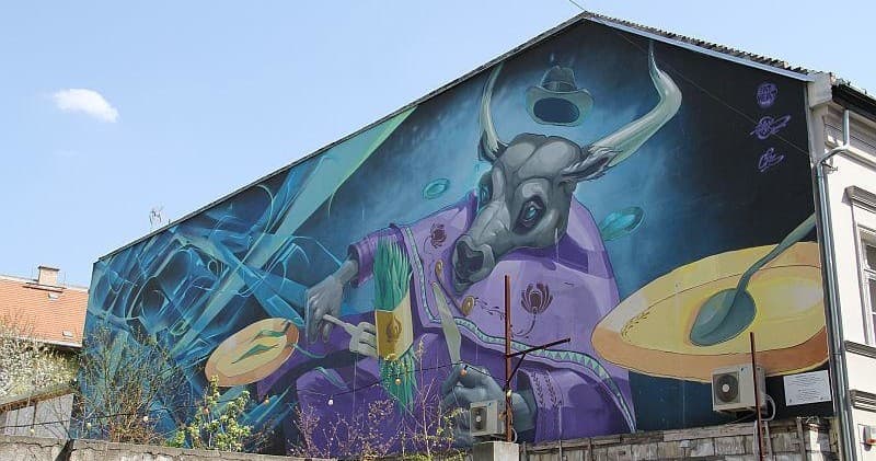 Panoramic street-art mural featuring stylized animals in Budapest