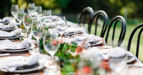 Elegant outdoor long dining table set for al fresco vineyard feast