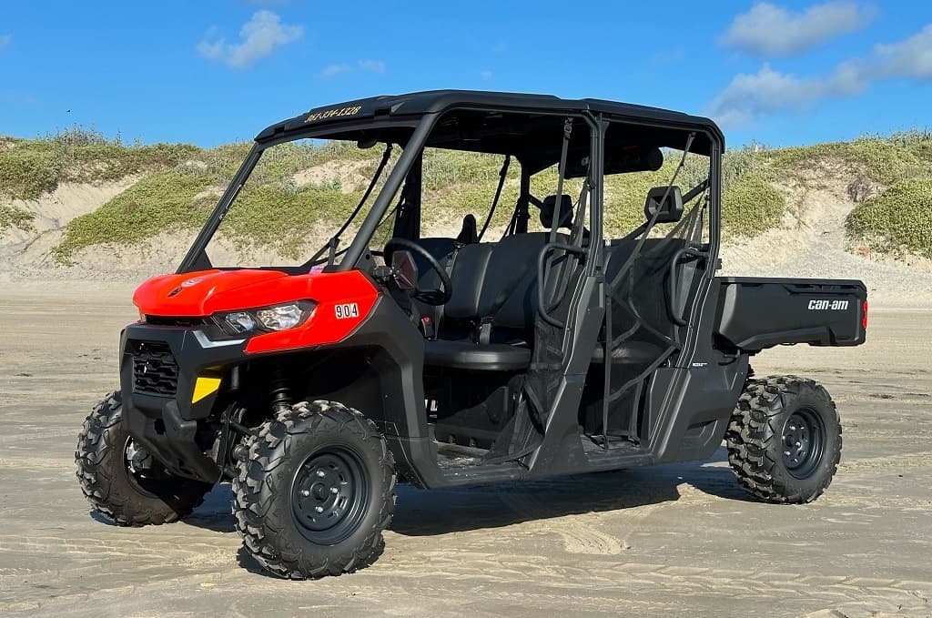 Red-black UTV side-by-side on beach for rugged coastal exploration