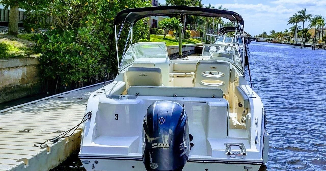 Sterndrive boat tied to dock in Cape Coral canal