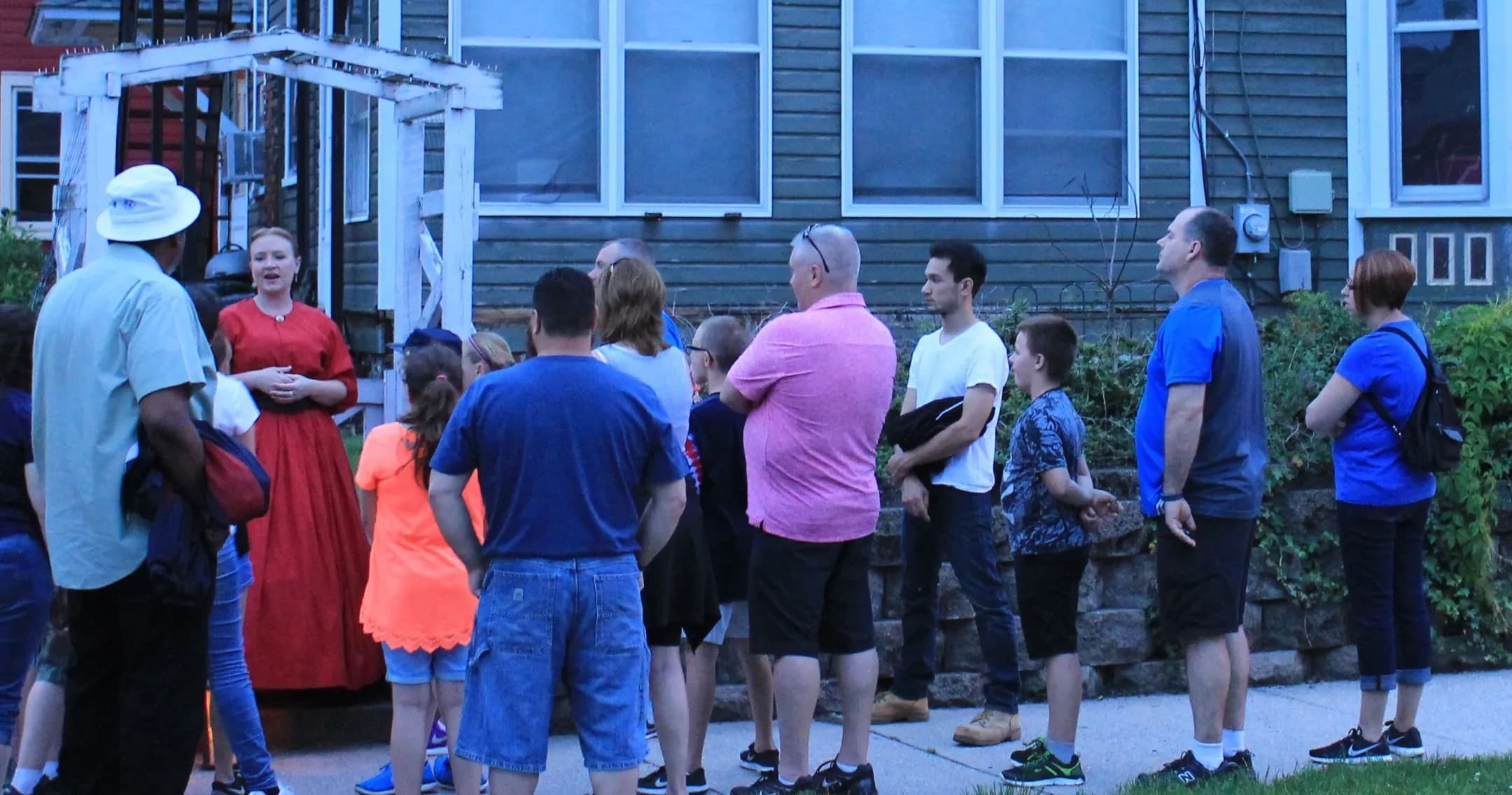 Ghost tour group gathered on historic Gettysburg street at dusk