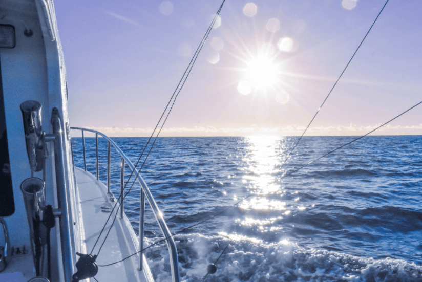 Fishing charter bow view over Pacific Ocean near Kauai sunrise