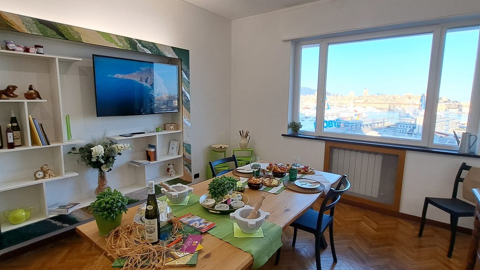 Sunny dining space set for cooking experience with city view