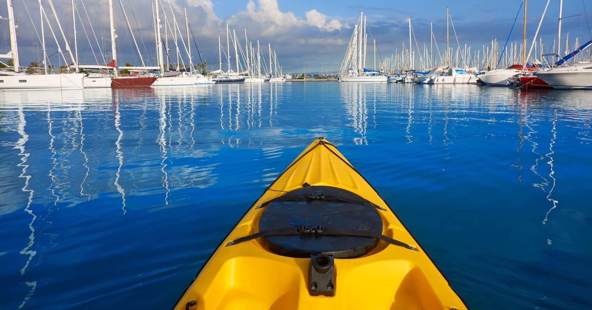 Yellow kayak prow in Santa Barbara marina at calm sea