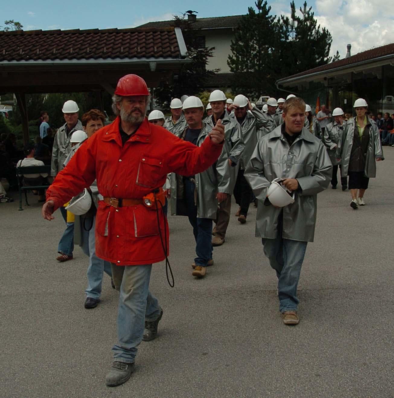 Guided silver mine tour group gathering outdoors at mine entrance