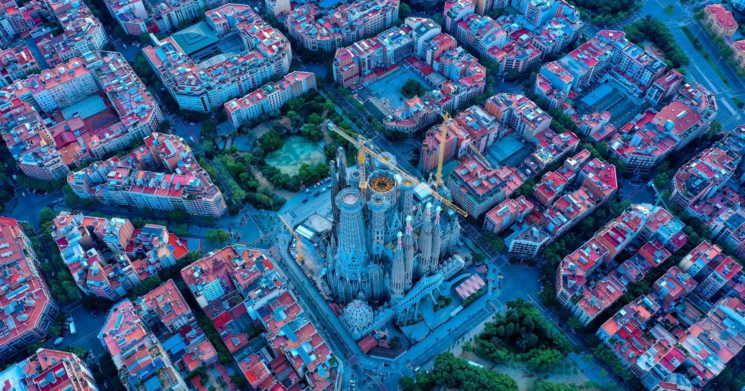 Aerial drone view of Barcelona Eixample grid around Sagrada Família