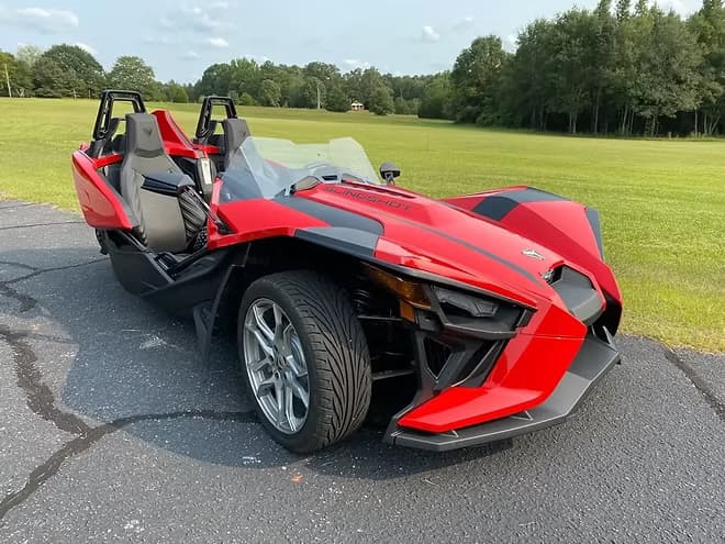 Land Adventures with Red Polaris Slingshot Rental in Houston