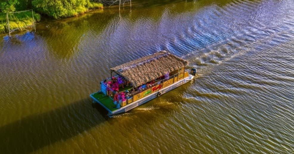 Aerial view of party boat cruising bayou waters near New Orleans