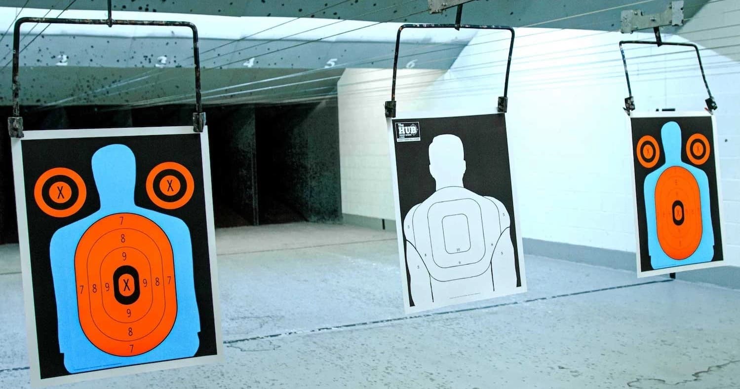 Paper and steel targets set at snowy outdoor shooting range
