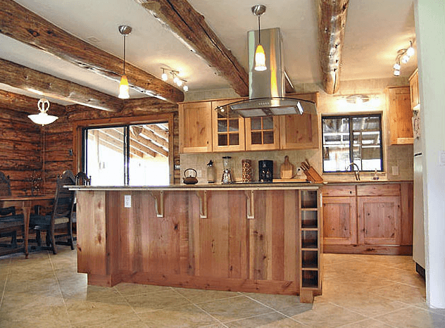 Rustic cabin kitchen and dining area at Trinity Hot Springs lodge
