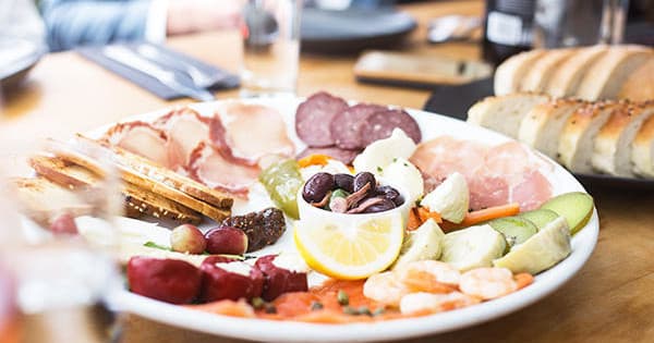 Grazing board charcuterie platter served at indoor tasting table