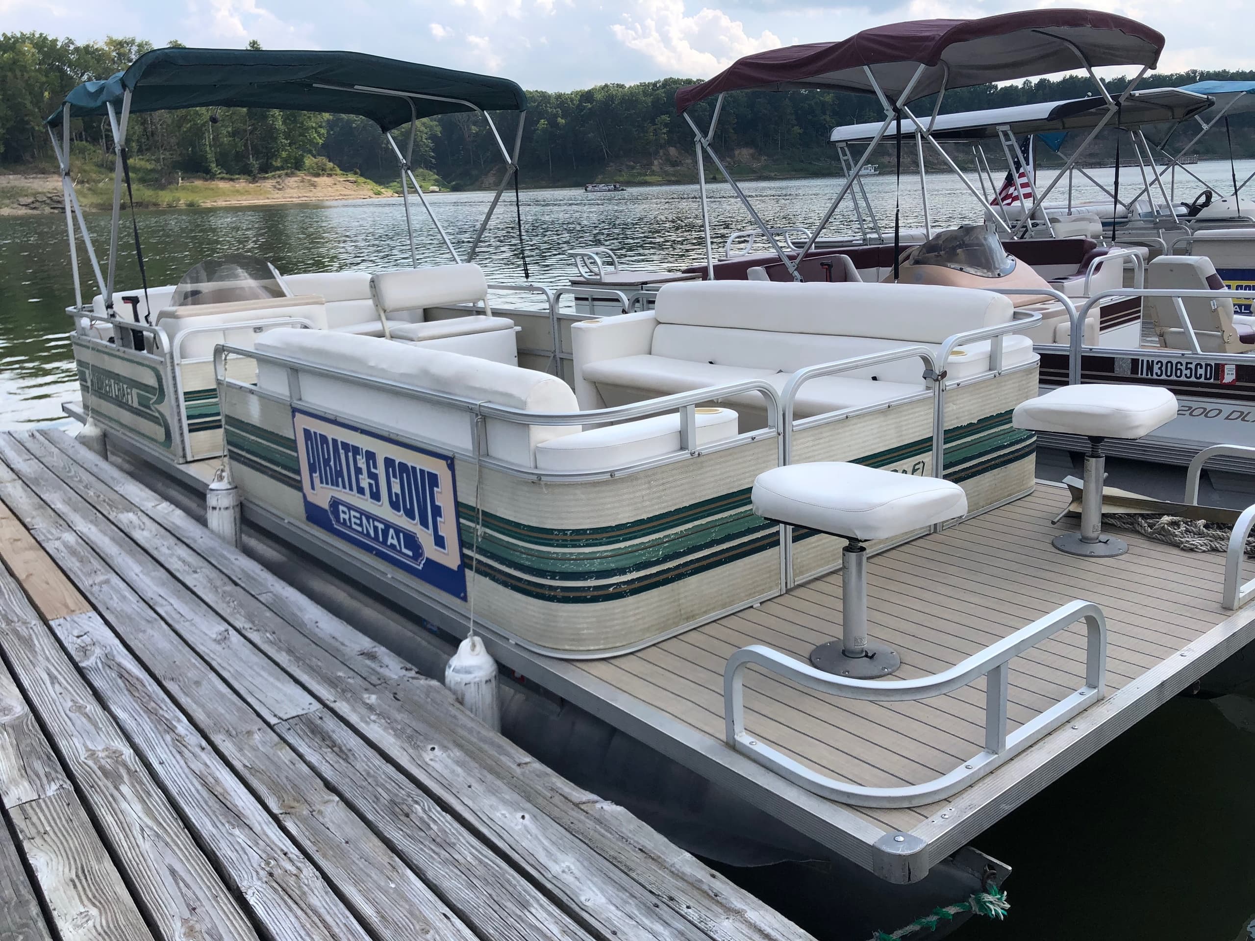 Spacious pontoon deck moored at scenic marina dock