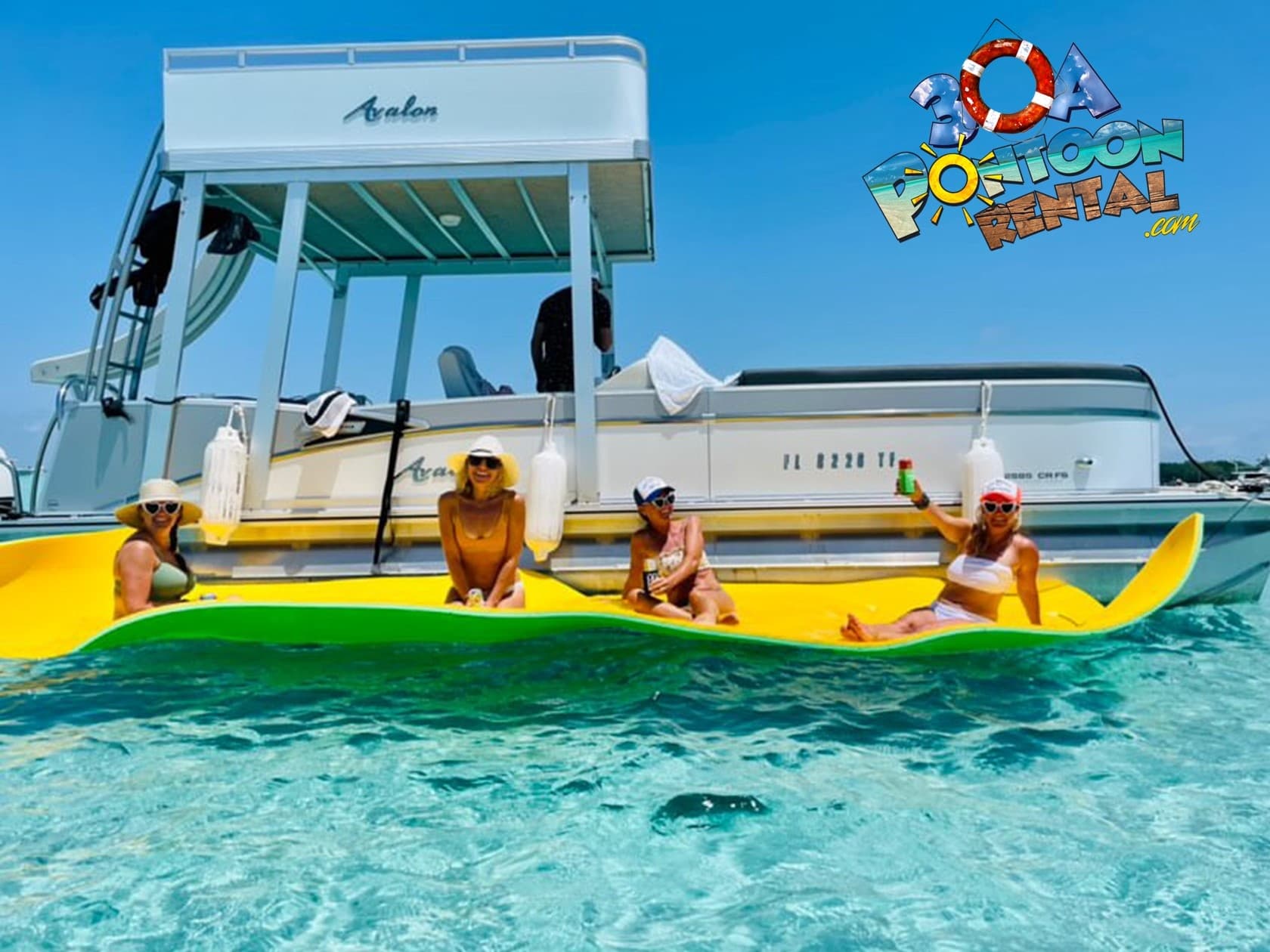 Family enjoying banana boat tow and pontoon in clear Gulf
