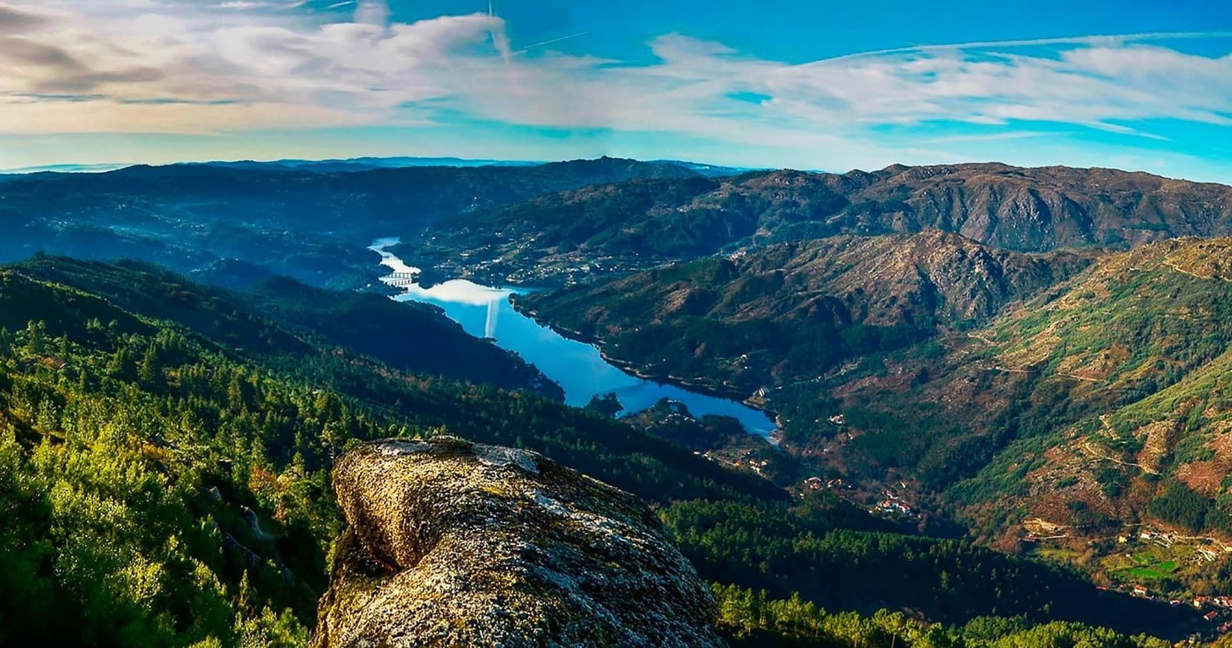 Scenic mountain valley vista with river, ideal for hiking