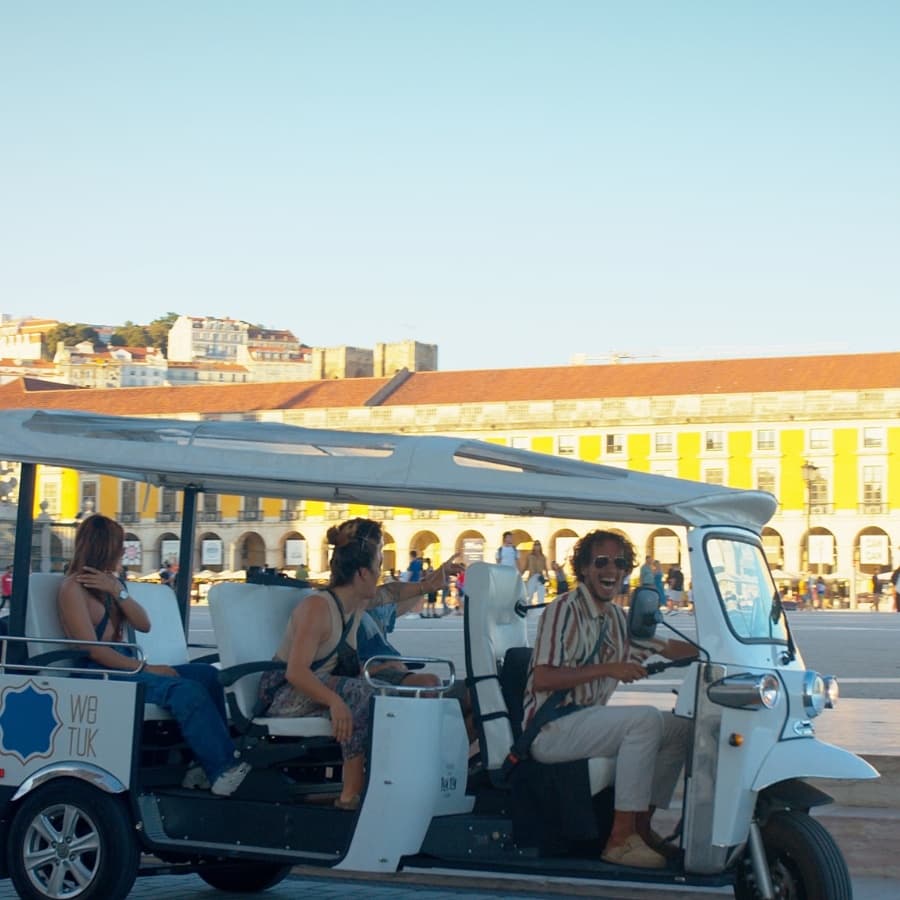 Sunset tuk-tuk city tour at historic riverside plaza