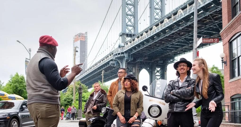 Guide leading sidecar tour near Manhattan Bridge in DUMBO