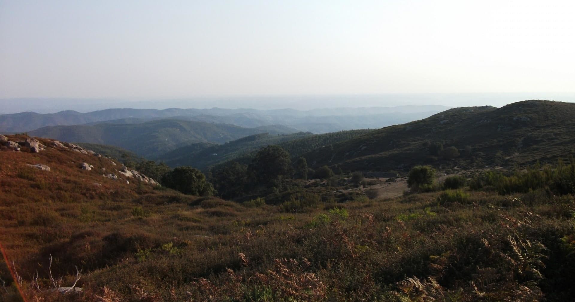Panoramic mountain vista hiking trail over rolling hills