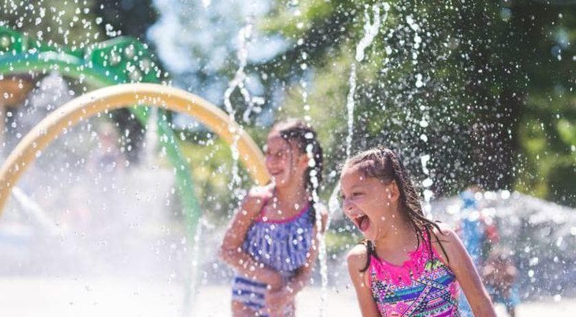 Kids laughing in pool spray at Chermside outdoor splash park