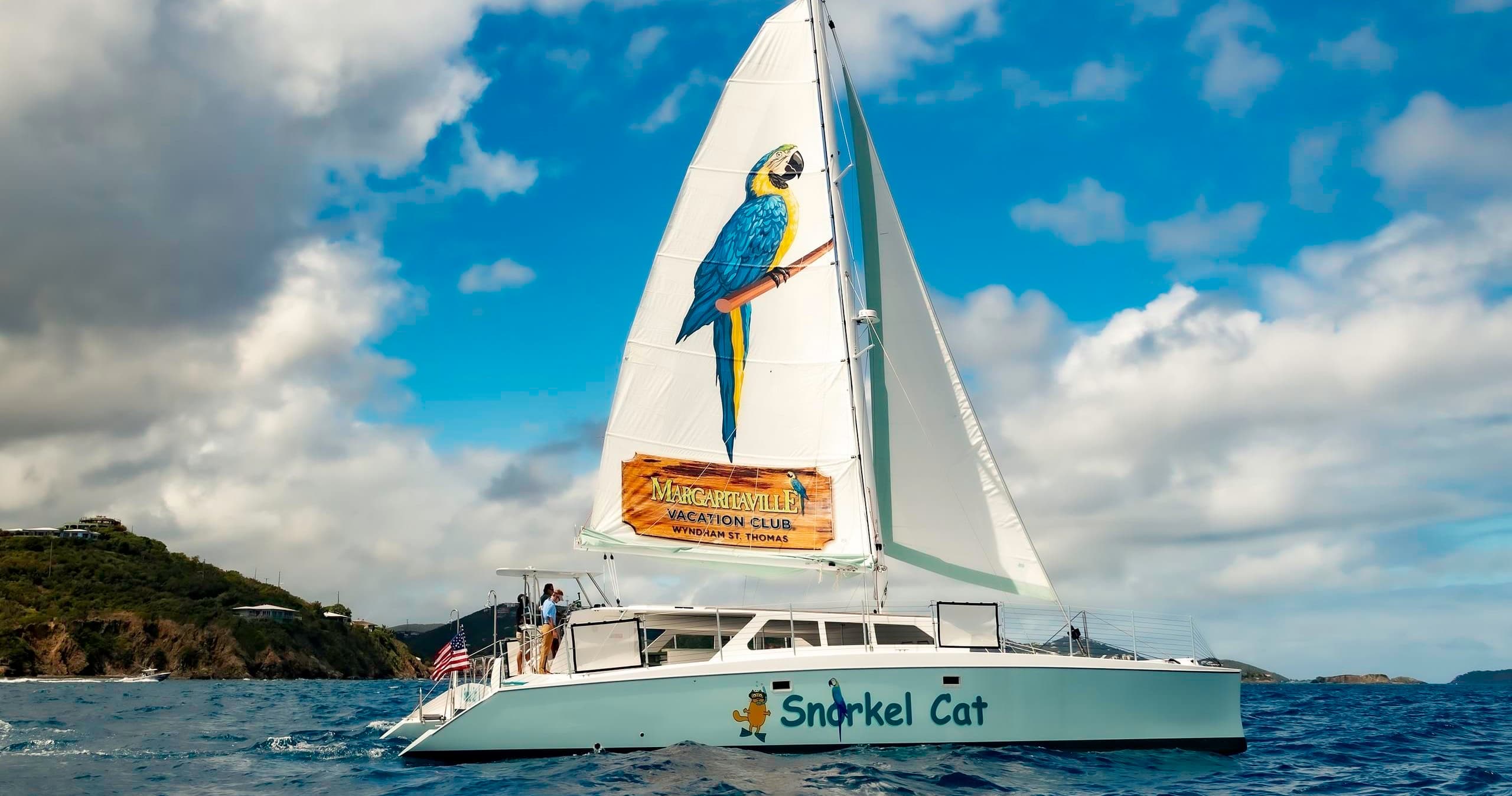 Catamaran charter sailing near tropical island for day trips