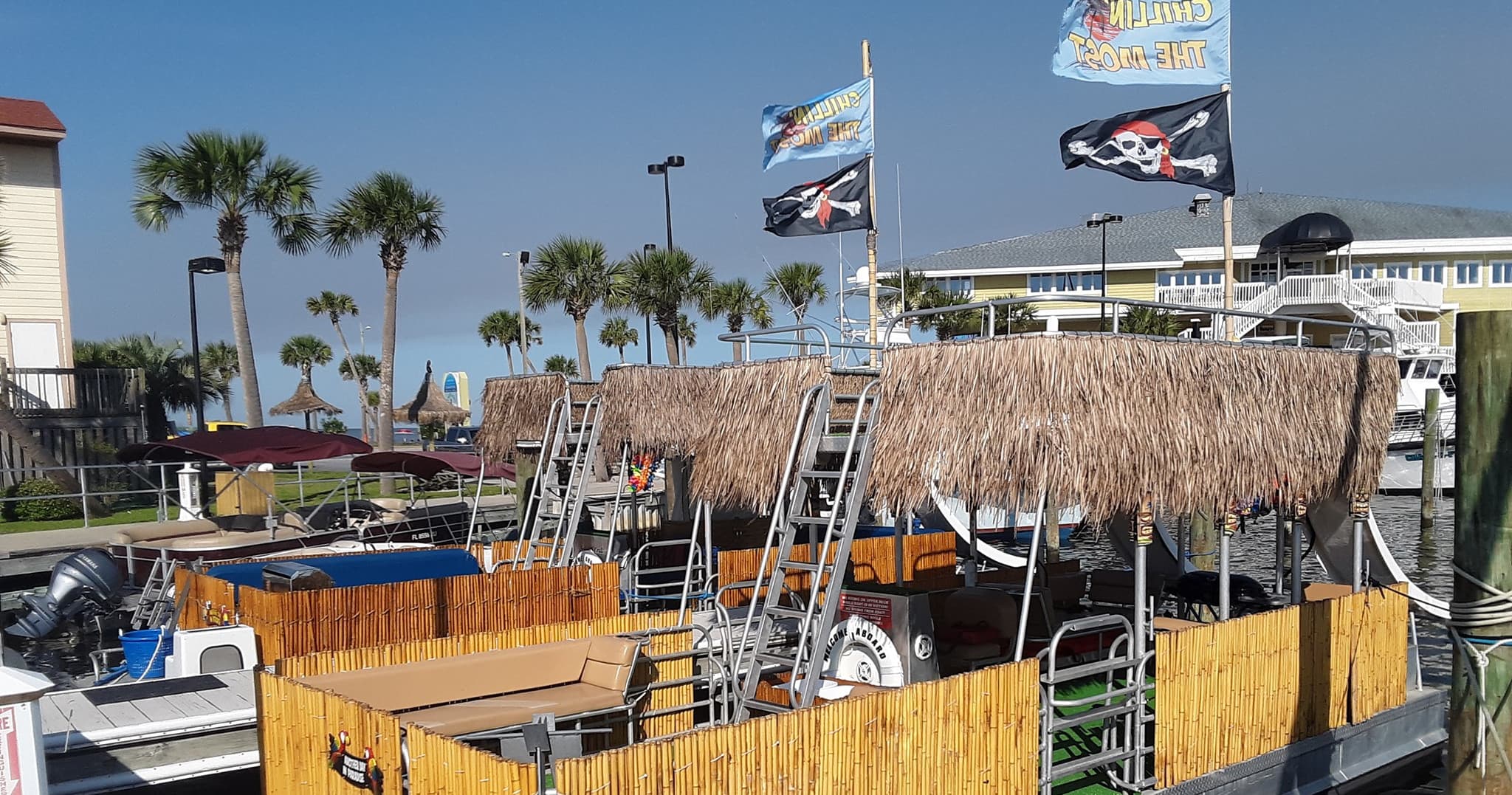 Tiki-top pontoon boat at Pensacola Beach marina for rentals