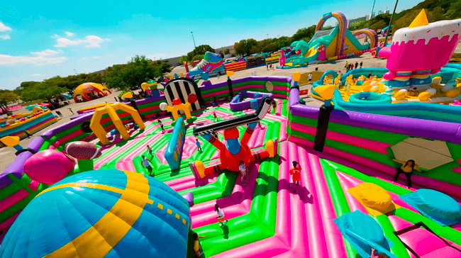 Aerial view of colorful outdoor inflatable obstacle course event