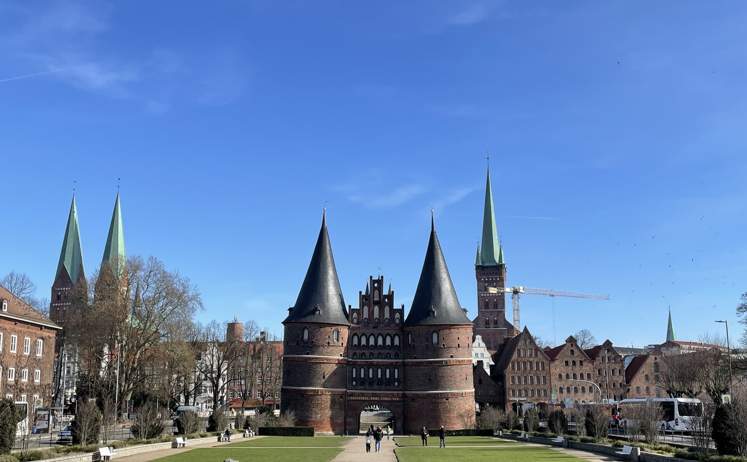 Historic city gate and skyline in European town square
