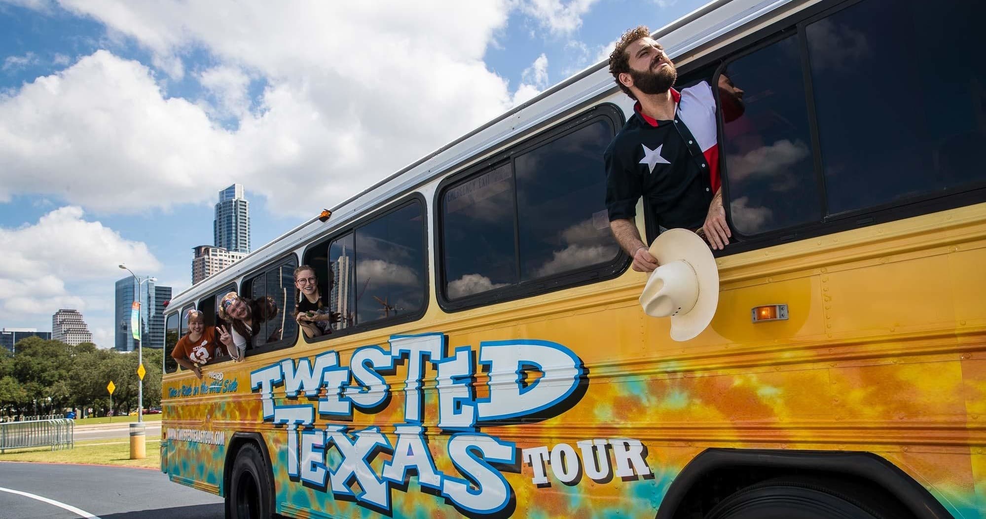 Twisted Texas Tour bus driving through Austin streets