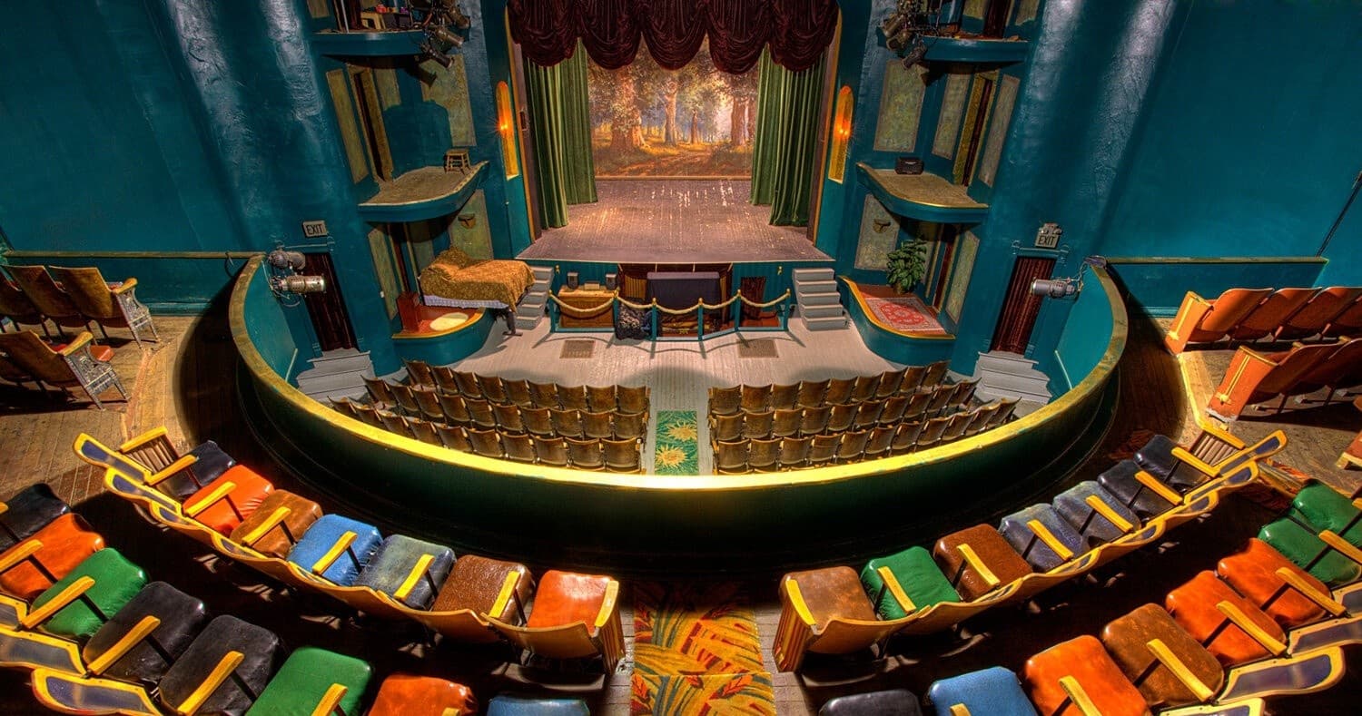 Philipsburg theater interior with colorful auditorium seating facing stage